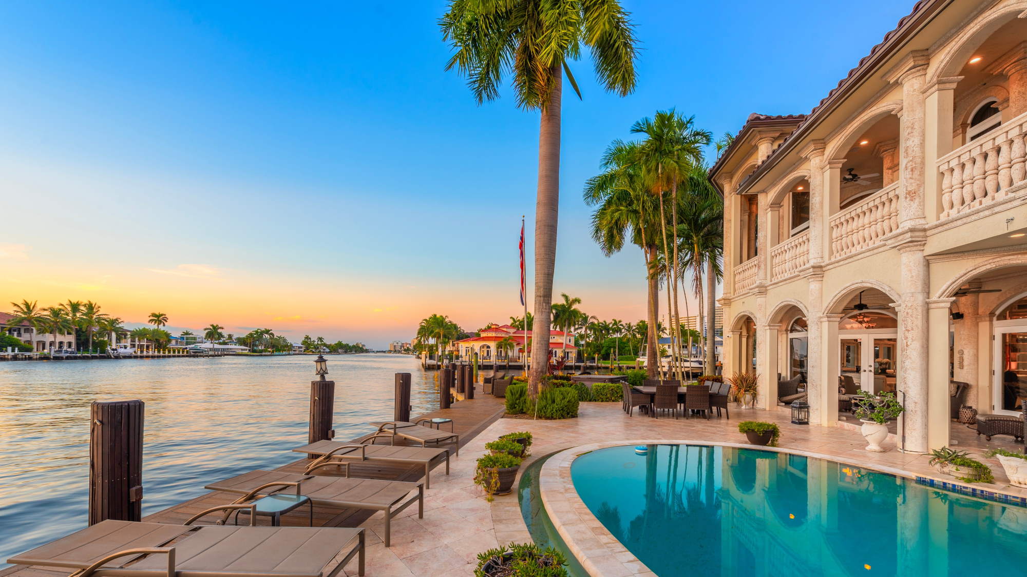 Couple sitting together on couch looking at laptop